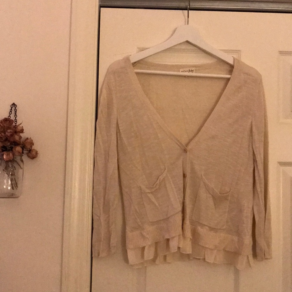 Cardigan with girly details.